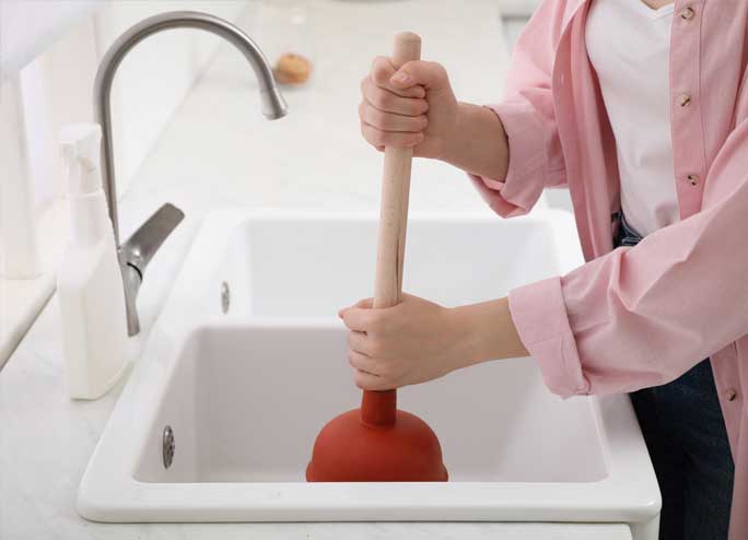 unclogging a sink